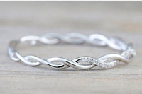 Infinity Twist Wedding Band with Prong Set Stones set in Sterling Sliver  WB001