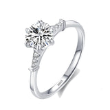 Round engagement ring with three side graduating stones 