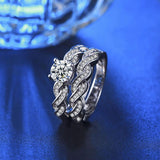 Wedding set round center stones with infinity twist side and side stones 