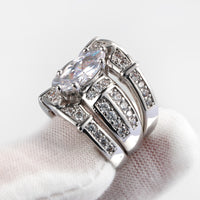 Marquise center stone with triple band wedding set, channeled side stones