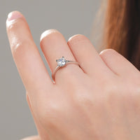 Solitaire engagement ring round with prongs like hearts 