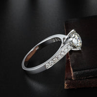 engagement ring with channel side stones round