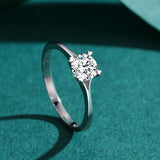 Silver round ring with heart shaped prongs 