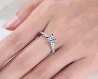 round engagement ring with side stones