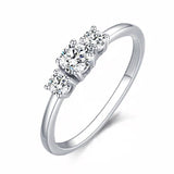 .45ctw Classic Petite Round Three Stone Engagement Ring With Heart Cut Outs Set in Sterling Silver Eng041